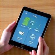 Tablet displaying smart home controls for lighting and temperature, easy interface
