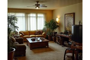 Before image of a cluttered, dim living room